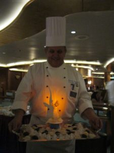 Caribbean Princess Chef's Table CB Chef presenting Biscotti