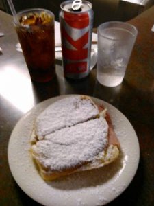 Mallorca Sandwich.  Ham and cheese on a sweet bun dusted with powdered sugar.  