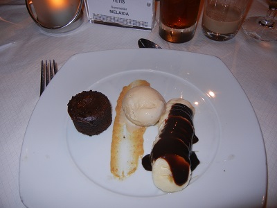 Warm chocolate cake with vanilla ice cream and chocolate covered banana