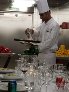 Chef Santosh finishing the quail prior to plating it. Chef Santosh finishing the quail prior to plating it.